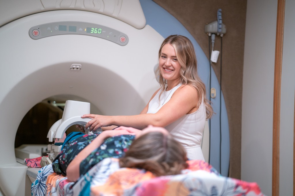 A patient entering an MRI machine
